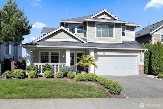 20325 90th Pl S, Kent, WA 98031 - view of front of house featuring driveway, a porch, a garage, a front lawn, and board and batten siding