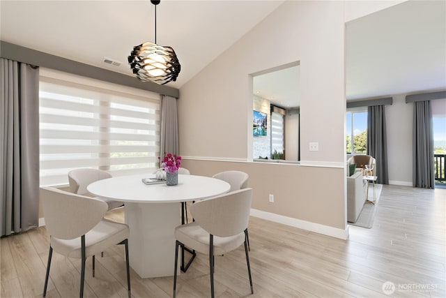 20325 90th Pl S, Kent, WA 98031 - dining space featuring vaulted ceiling, light wood finished floors, and baseboards