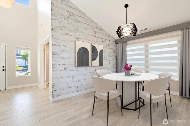 20325 90th Pl S, Kent, WA 98031 - dining room with light wood-style floors, high vaulted ceiling, and baseboards