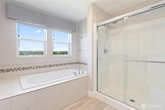 20325 90th Pl S, Kent, WA 98031 - bathroom with a shower stall, a bath, and wood finished floors