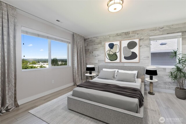 20325 90th Pl S, Kent, WA 98031 - bedroom featuring crown molding, baseboards, wood finished floors, and an accent wall