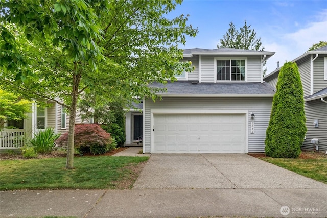 1082 G St SW, Tumwater, WA 98512 - view of front facade featuring driveway, a garage, and a shingled roof