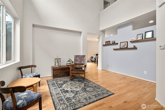1082 G St SW, Tumwater, WA 98512 - home office with wood finished floors, baseboards, and a towering ceiling