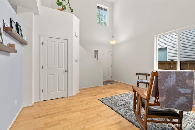 1082 G St SW, Tumwater, WA 98512 - entrance foyer with a high ceiling, wood finished floors, and baseboards