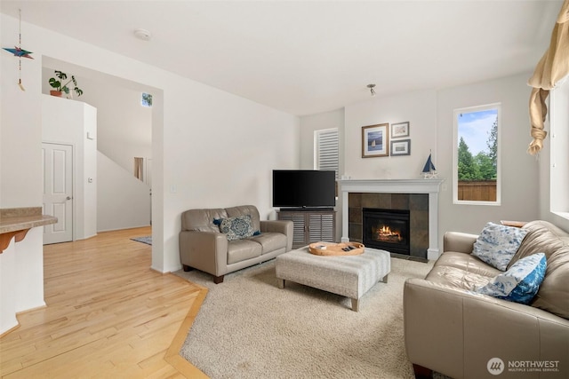 1082 G St SW, Tumwater, WA 98512 - living area featuring light wood finished floors and a fireplace