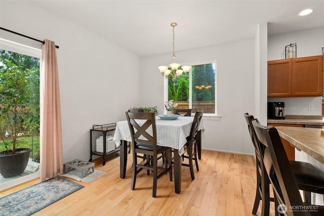 1082 G St SW, Tumwater, WA 98512 - dining space with light wood-style floors, a chandelier, baseboards, and recessed lighting