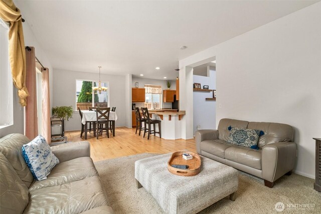 1082 G St SW, Tumwater, WA 98512 - living area with a chandelier, recessed lighting, and light wood-style flooring
