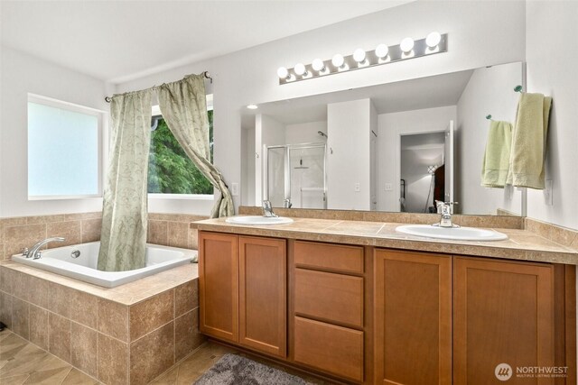 1082 G St SW, Tumwater, WA 98512 - full bathroom with curtained shower, tiled bath, double vanity, and tile patterned flooring