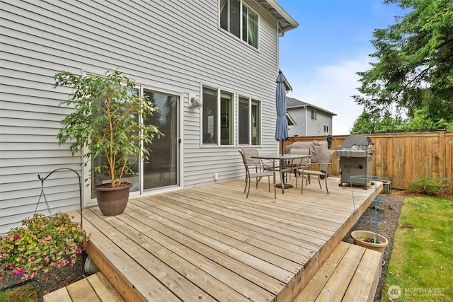 1082 G St SW, Tumwater, WA 98512 - wooden deck with outdoor dining space and area for grilling