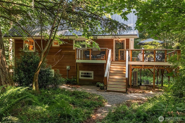 27603 145th Ave SW, Vashon, WA 98070 - back of house with stairs and a wooden deck