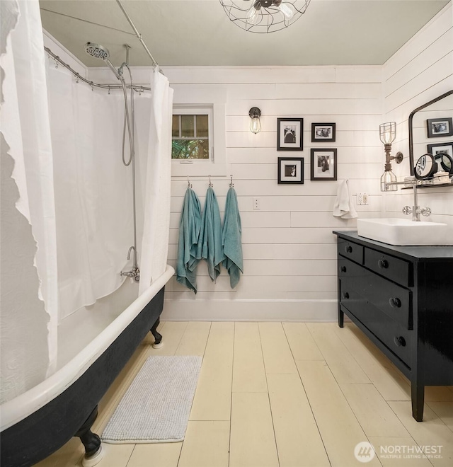 27603 145th Ave SW, Vashon, WA 98070 - full bath with vanity, shower / tub combo, and wooden walls
