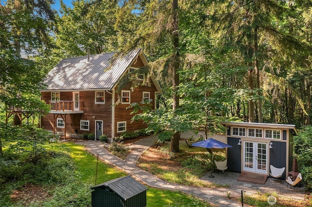 27603 145th Ave SW, Vashon, WA 98070 - rear view of house featuring french doors and an outdoor structure