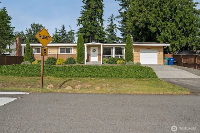 35639 12th Ave SW, Federal Way, WA 98023 - ranch-style house with a garage, driveway, and brick siding