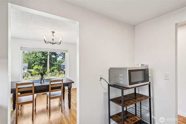 3007 23rd Ave S, Seattle, WA 98144 - dining space with a chandelier and wood finished floors
