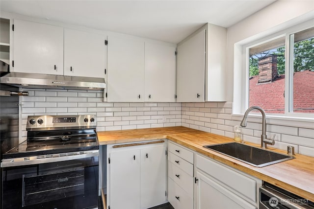 3007 23rd Ave S, Seattle, WA 98144 - kitchen with electric stove, extractor fan, wood counters, dishwashing machine, and white cabinets