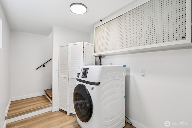 3007 23rd Ave S, Seattle, WA 98144 - laundry area featuring washer / clothes dryer and light wood-style flooring