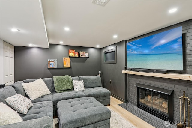 3007 23rd Ave S, Seattle, WA 98144 - home theater with wood finished floors, a brick fireplace, and recessed lighting