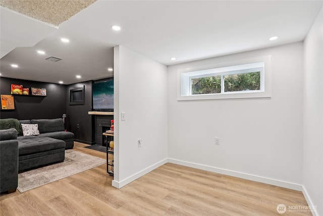 3007 23rd Ave S, Seattle, WA 98144 - living area featuring light wood-type flooring, a fireplace with flush hearth, and recessed lighting