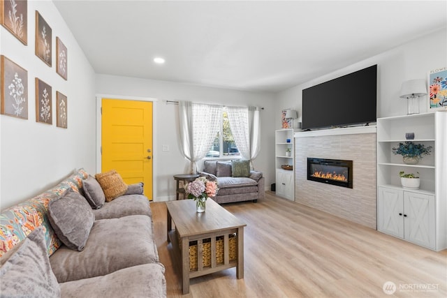 3628S Sheridan Ave, Tacoma, WA 98418 - living area with light wood-style flooring, a tiled fireplace, and recessed lighting
