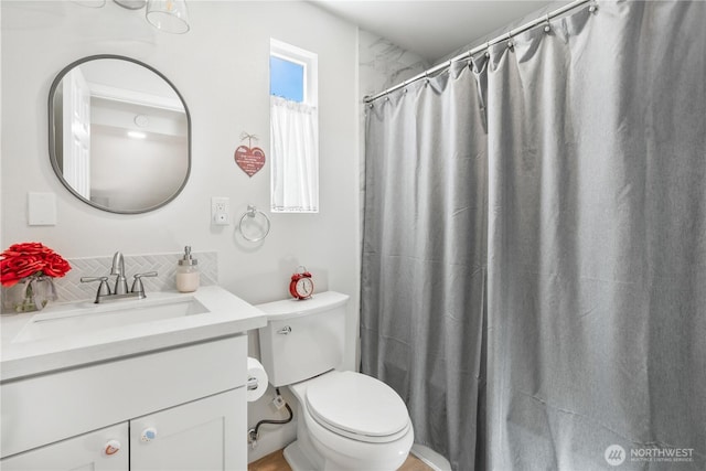 3628S Sheridan Ave, Tacoma, WA 98418 - bathroom featuring vanity, toilet, decorative backsplash, and a shower with shower curtain