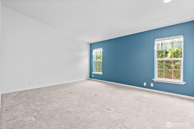 1933 Windflower Ln SE, Lacey, WA 98503 - spare room with baseboards and carpet