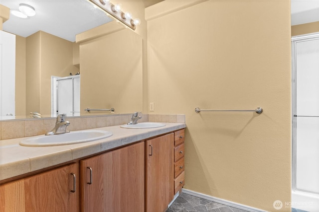 1933 Windflower Ln SE, Lacey, WA 98503 - full bath featuring double vanity, a shower with shower door, and baseboards