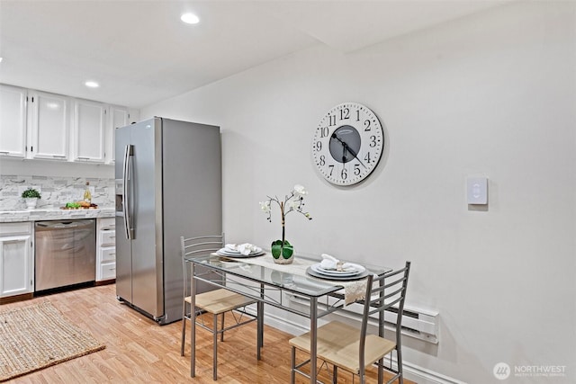 14600 SE 176th St Unit H11, Renton, WA 98058 - kitchen with appliances with stainless steel finishes, light wood-style floors, light countertops, white cabinets, and recessed lighting