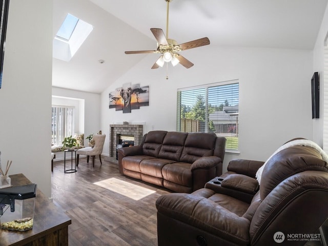 4715 247th St E, Graham, WA 98338 - living area with healthy amount of natural light, a brick fireplace, a skylight, wood finished floors, and high vaulted ceiling