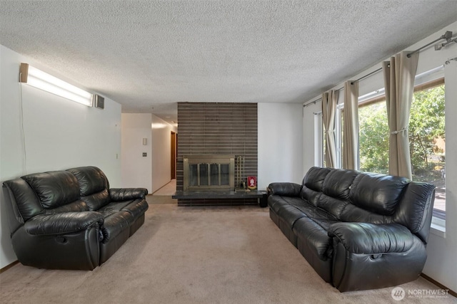 6201 47th Ave S, Seattle, WA 98118 - living room with carpet, a textured ceiling, and a large fireplace