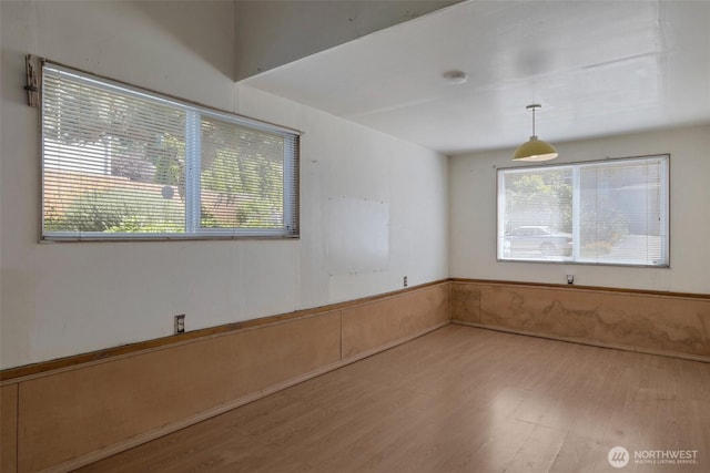 6201 47th Ave S, Seattle, WA 98118 - empty room with healthy amount of natural light and wood finished floors