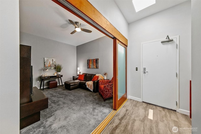 17 W Mercer St Unit 302, Seattle, WA 98119 - entrance foyer featuring ceiling fan, a skylight, wood finished floors, and baseboards