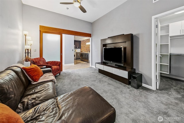 17 W Mercer St Unit 302, Seattle, WA 98119 - carpeted living area with ceiling fan and baseboards