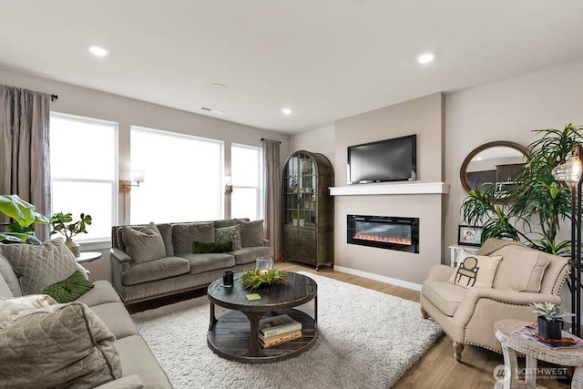 3905 98th Avenue Ct E Unit 33, Edgewood, WA 98371 - living room with light wood finished floors, a glass covered fireplace, and recessed lighting
