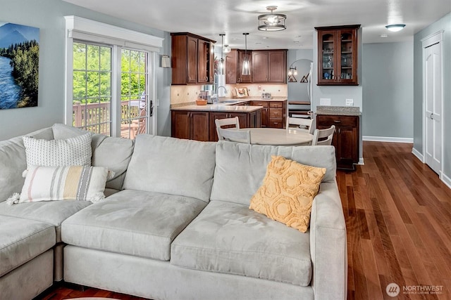 23304 21st Ave SE, Bothell, WA 98021 - living area featuring baseboards and dark wood-type flooring