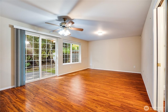 10513 SE 250th Pl Unit F-106, Kent, WA 98031 - empty room with a ceiling fan and wood finished floors