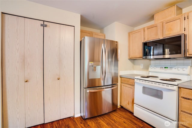 10513 SE 250th Pl Unit F-106, Kent, WA 98031 - kitchen with appliances with stainless steel finishes, light brown cabinets, dark wood-style floors, and light countertops
