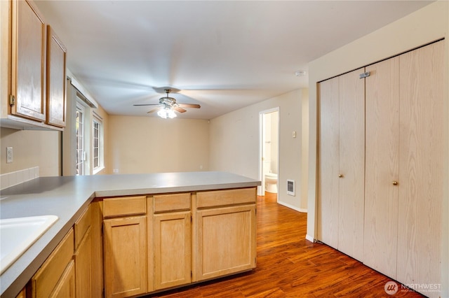 10513 SE 250th Pl Unit F-106, Kent, WA 98031 - kitchen with a peninsula, dark wood-style floors, ceiling fan, and light countertops