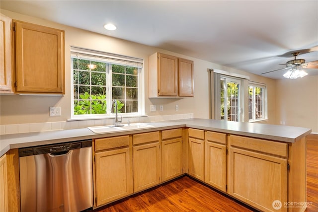 10513 SE 250th Pl Unit F-106, Kent, WA 98031 - kitchen featuring dishwasher, a peninsula, light countertops, dark wood-type flooring, and a ceiling fan