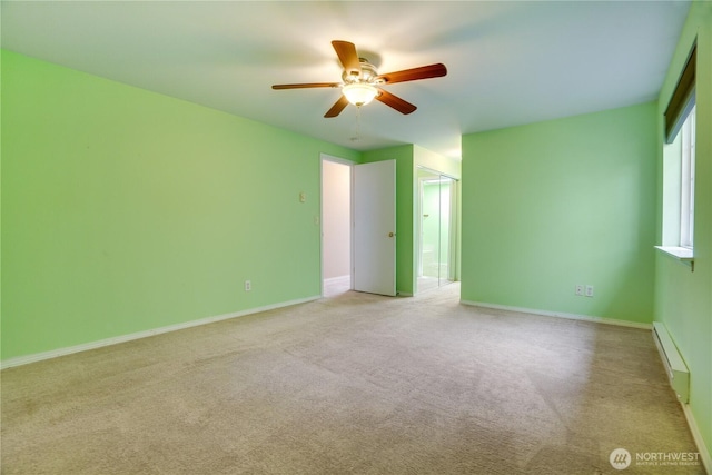 10513 SE 250th Pl Unit F-106, Kent, WA 98031 - carpeted spare room with baseboard heating and a ceiling fan