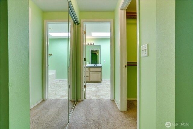 10513 SE 250th Pl Unit F-106, Kent, WA 98031 - corridor featuring carpet and baseboards