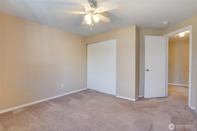 10513 SE 250th Pl Unit F-106, Kent, WA 98031 - unfurnished bedroom featuring carpet flooring, a closet, and a ceiling fan