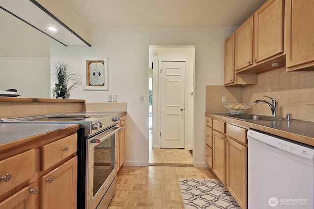 311 Edgecliff Dr, Langley, WA 98260 - kitchen featuring electric range, dishwasher, a sink, ornamental molding, and baseboards