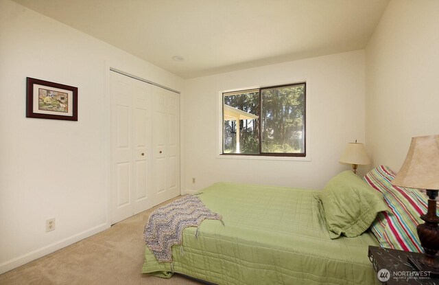 311 Edgecliff Dr, Langley, WA 98260 - carpeted bedroom with a closet and baseboards