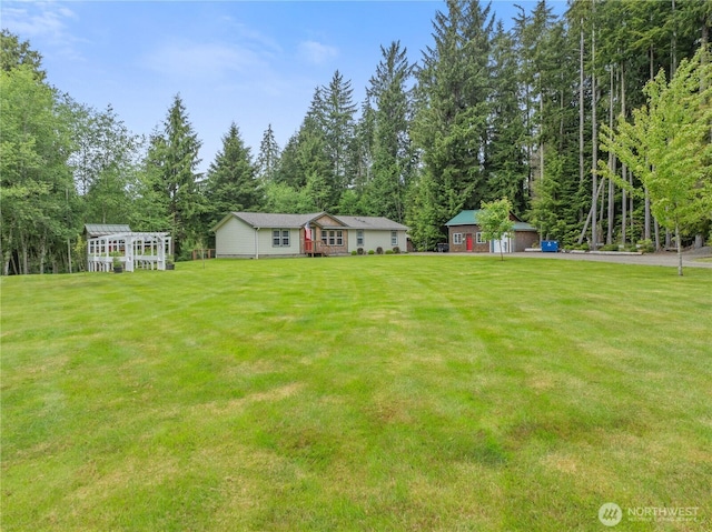 132 River Park Rd, Forks, WA 98331 - view of green lawn featuring view of wooded area