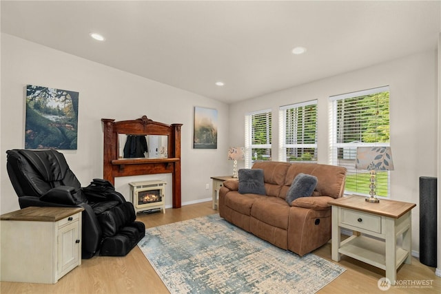 132 River Park Rd, Forks, WA 98331 - living area featuring light wood-style floors, baseboards, a glass covered fireplace, and recessed lighting