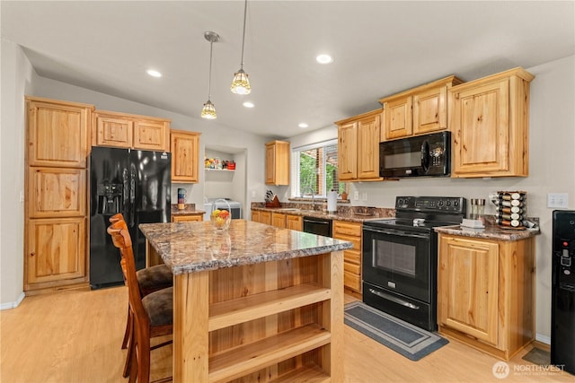 132 River Park Rd, Forks, WA 98331 - kitchen with black appliances, separate washer and dryer, light brown cabinets, and recessed lighting