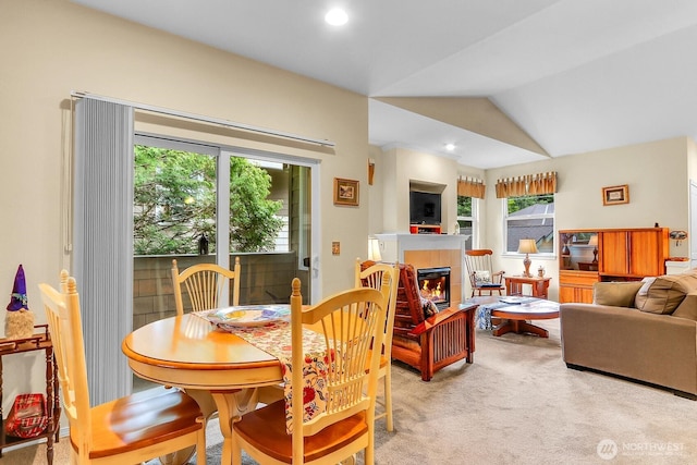 1500 S 18th St Unit F202, Renton, WA 98055 - dining area with light carpet, a tile fireplace, vaulted ceiling, and recessed lighting