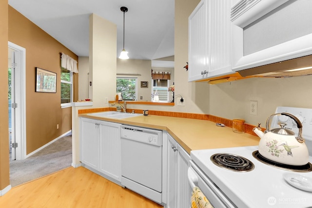 1500 S 18th St Unit F202, Renton, WA 98055 - kitchen featuring white appliances, light wood finished floors, light countertops, white cabinetry, and decorative light fixtures