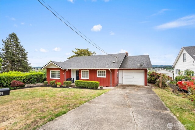 261 SE Adams Ave, Chehalis, WA 98532 - ranch-style home with a garage, a front yard, board and batten siding, driveway, and roof with shingles