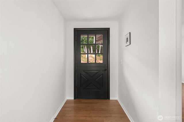 261 SE Adams Ave, Chehalis, WA 98532 - doorway to outside featuring wood finished floors and baseboards